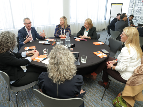 Total Health attendees take part in a small-group roundtable discussion.