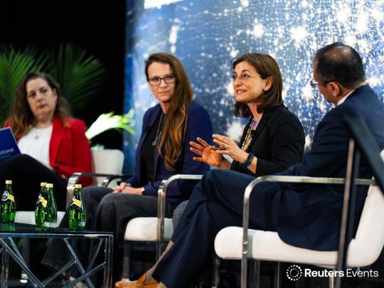 Three female and one male pharma executives on stage at a panel discussion at Reuters Events Pharma USA 2026