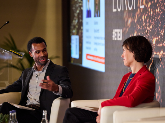 Two conference speakers in conversation during a seated panel session at Energy Transition Europe.
