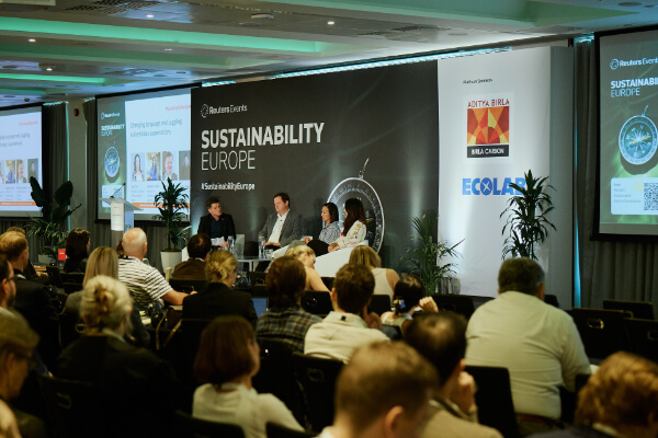 Wide view of the main conference hall as attendees watch an executive panel discussion at Reuters Events Sustainability Europe.