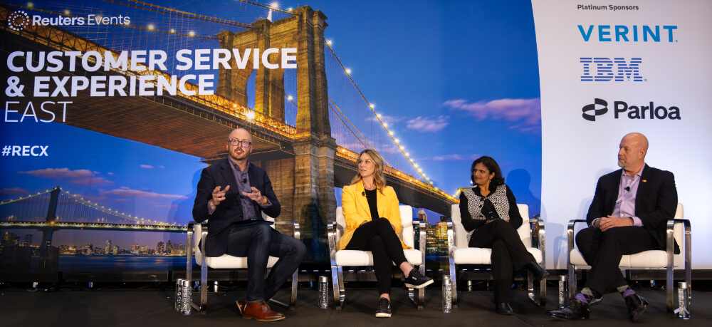 A panel of four diverse industry experts discussing customer experience on stage at the Reuters Events Customer Service & Experience East conference.