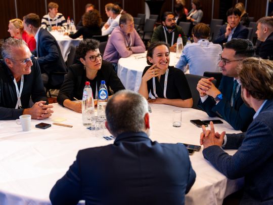 Senior insurance executives engaged in an active, collaborative roundtable workshop discussion at Reuters Events: The Future of Insurance