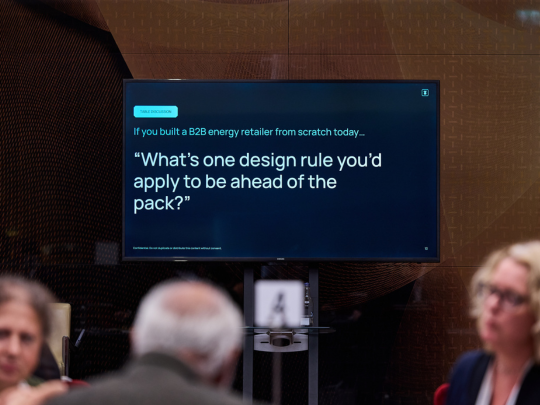 Workshop discussion prompt displayed on a screen during an Energy Transition Europe roundtable.