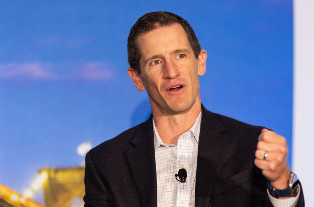 An speaker talking at a Reuters Events conference