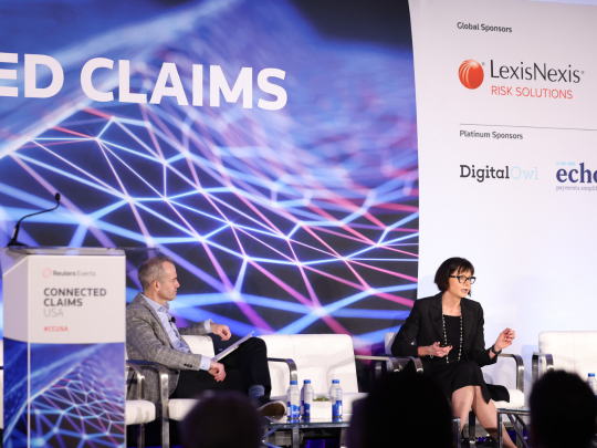 Two insurance industry leaders in conversation during a fireside chat on the Connected Claims USA main stage.