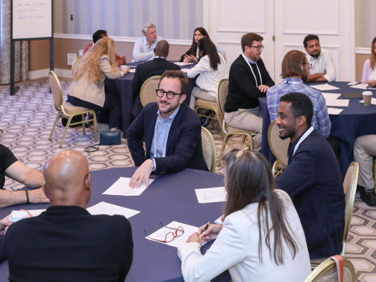 Attendees take part in a roundtable discussion at Momentum AI Austin