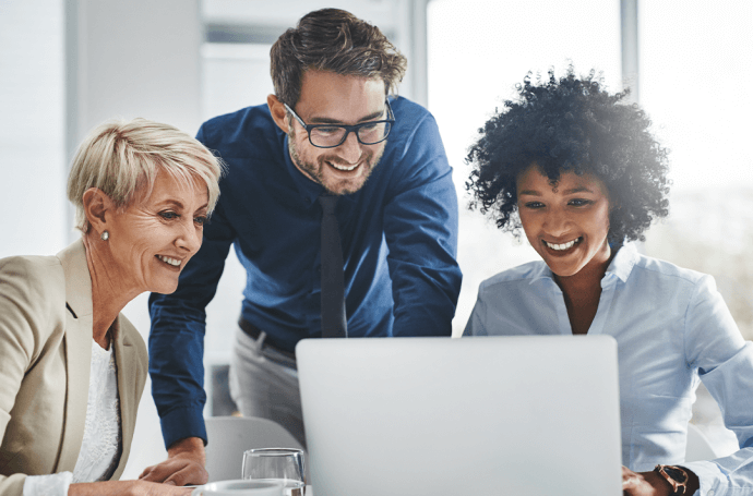 Three people looking at a computer screen